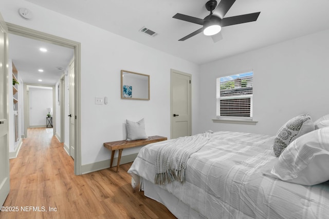 bedroom featuring light wood-type flooring and ceiling fan