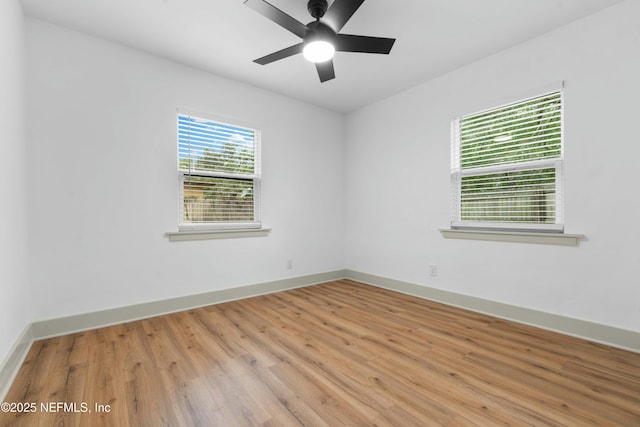 unfurnished room featuring ceiling fan and light hardwood / wood-style flooring