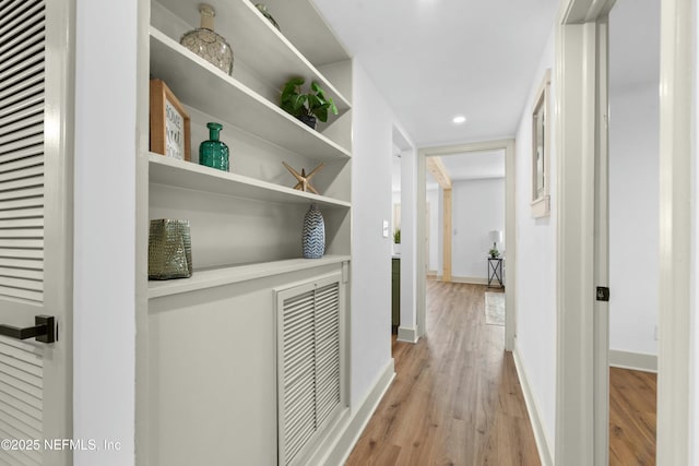 hallway with light wood-type flooring