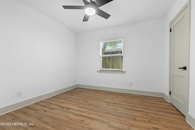 unfurnished room featuring ceiling fan and wood-type flooring