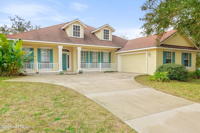 109 Bilbao Dr, Saint Augustine, FL 32086 - view of front facade featuring a front yard, a porch, and a garage