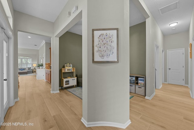 hall with light wood-type flooring