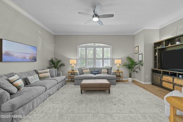 living room featuring ornamental molding, a textured ceiling, ceiling fan, and light hardwood / wood-style flooring