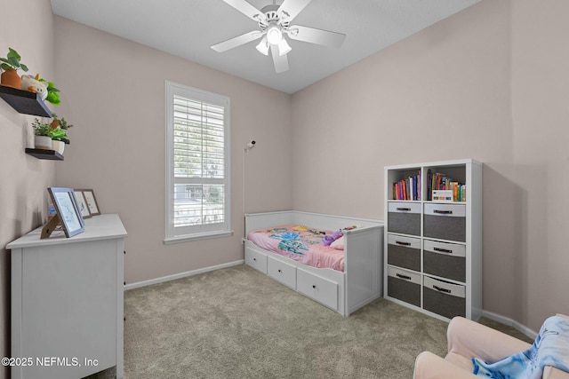 bedroom with ceiling fan and light carpet