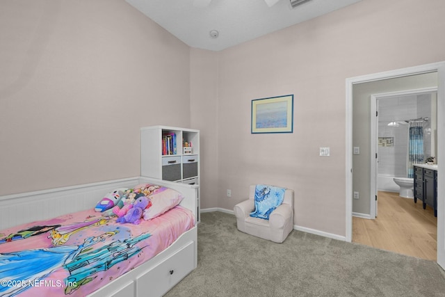 bedroom featuring light colored carpet