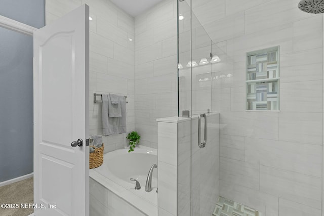 bathroom featuring separate shower and tub