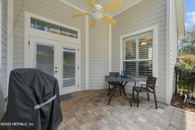 view of patio / terrace with ceiling fan and area for grilling