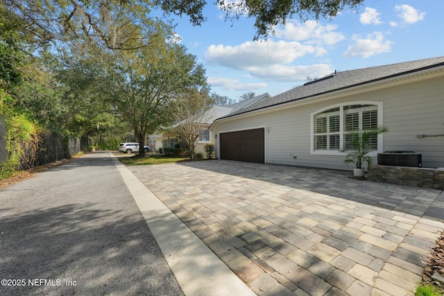 view of property exterior with a garage