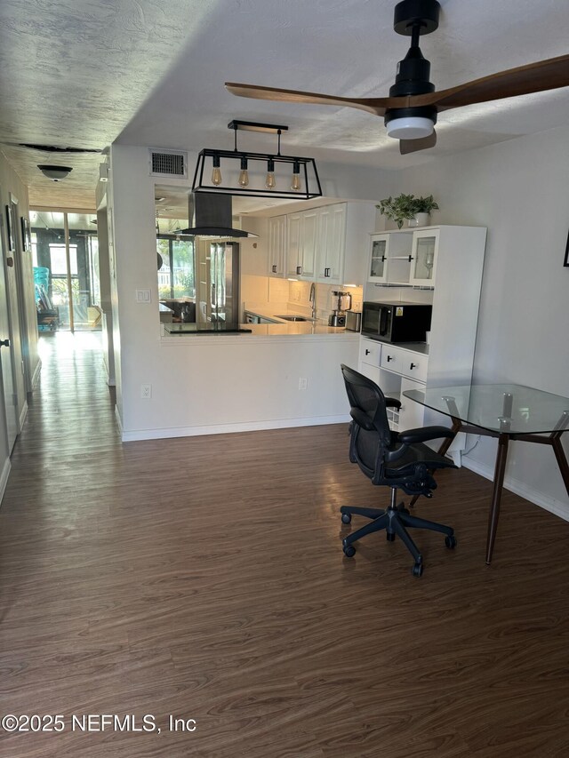 5500 Ocean Shore Blvd Unit 61, Ormond Beach, FL 32176 - office space featuring baseboards, visible vents, a ceiling fan, and wood finished floors