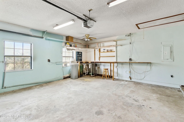 garage with a garage door opener and electric panel