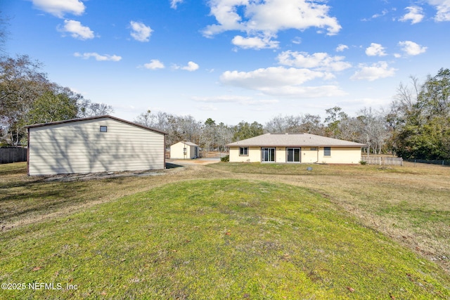 view of yard featuring a storage unit