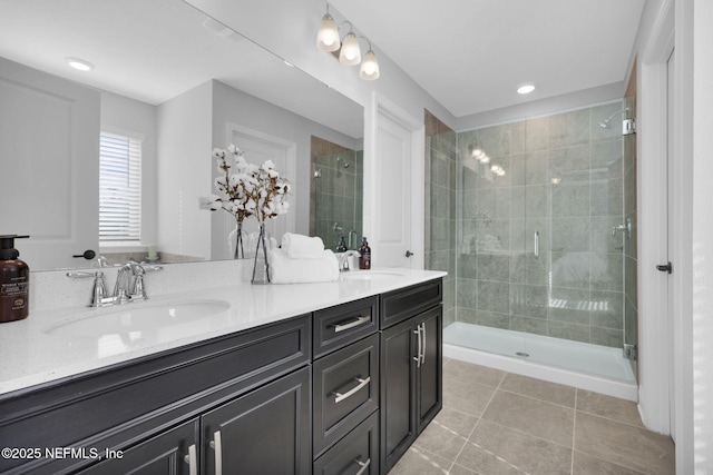 bathroom featuring vanity and a shower with shower door