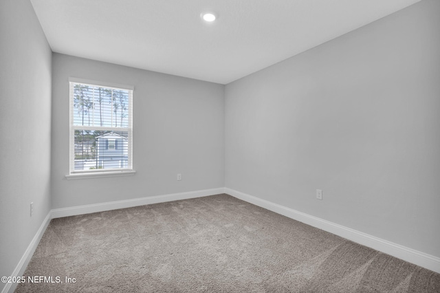 unfurnished room with carpet floors