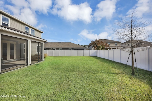 view of yard with a sunroom