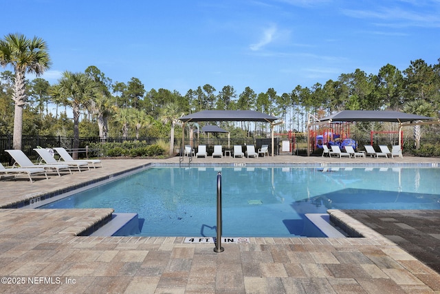 view of swimming pool with a gazebo and a patio area