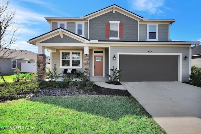 view of front facade with a porch, a garage, and a front lawn