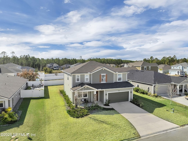 view of front of house featuring a garage and a front yard