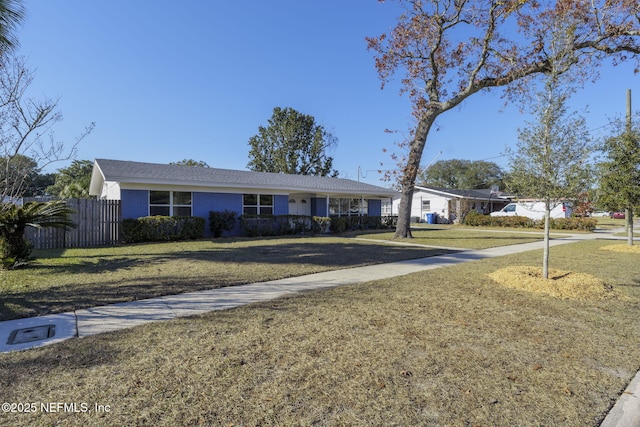 ranch-style house with a front yard