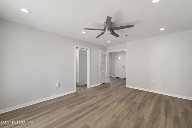 unfurnished bedroom featuring hardwood / wood-style floors and ceiling fan