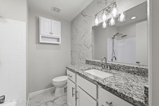 bathroom with walk in shower, vanity, and toilet