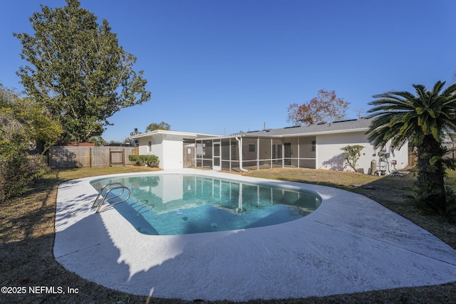 view of pool with a sunroom