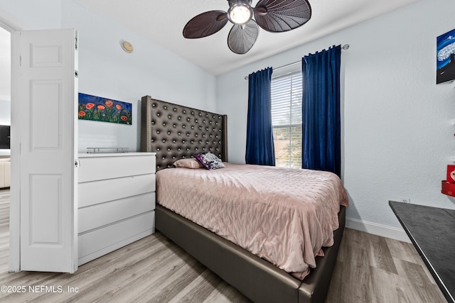 bedroom featuring ceiling fan and light wood-type flooring