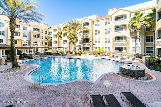 view of swimming pool with a patio area