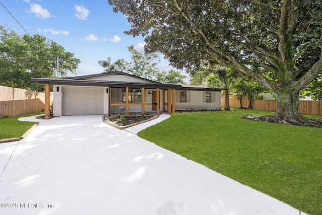 ranch-style home featuring a garage and a front yard