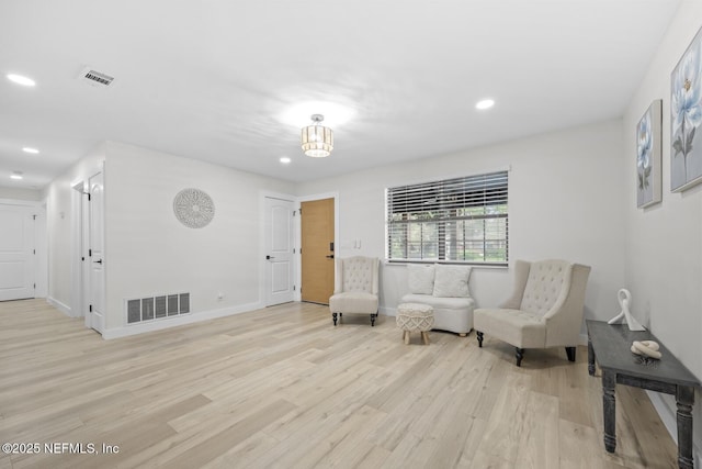 sitting room with light wood-type flooring