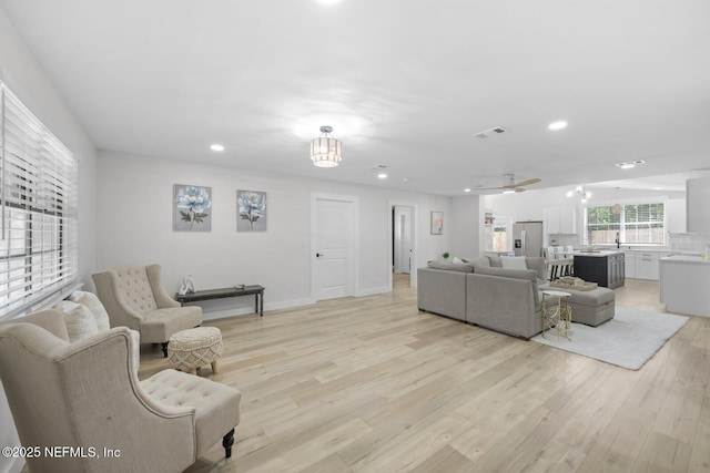 living room with light hardwood / wood-style flooring