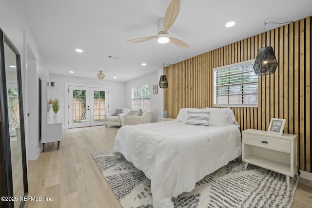 bedroom featuring french doors, ceiling fan, access to exterior, and light wood-type flooring