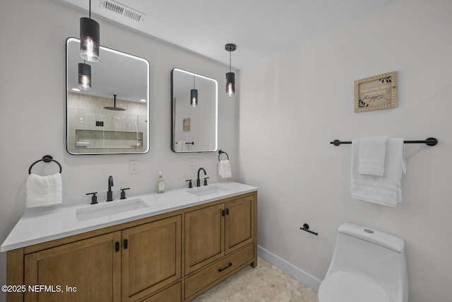 bathroom featuring walk in shower, vanity, and toilet