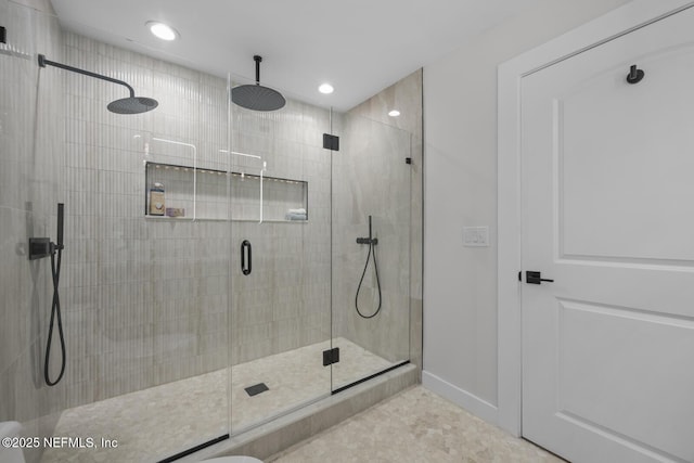 bathroom with a shower with shower door