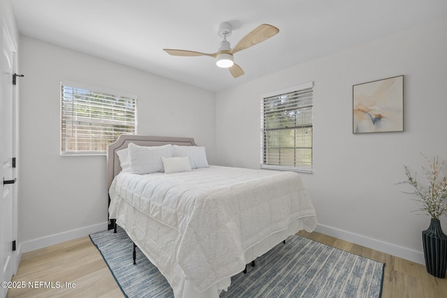 bedroom featuring ceiling fan and light hardwood / wood-style flooring