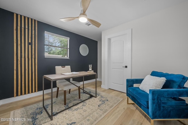 office area with hardwood / wood-style flooring and ceiling fan