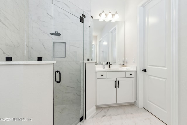 bathroom with walk in shower and vanity