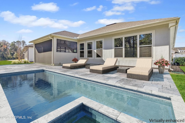 95062 Golden Glow Dr, Fernandina Beach, FL 32034 - back of property featuring an outdoor pool, a patio, a jacuzzi, a storage structure, and roof with shingles