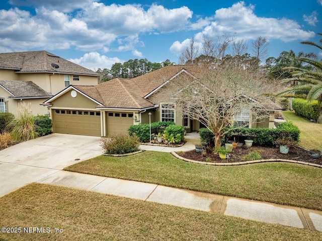 view of front facade with a garage and a front lawn