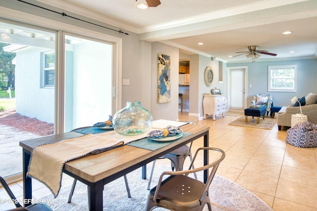 dining area with light tile patterned flooring, ceiling fan, and ornamental molding