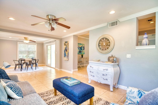 living room featuring light tile patterned floors, crown molding, and ceiling fan