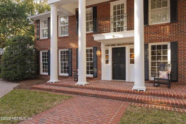 entrance to property with a balcony