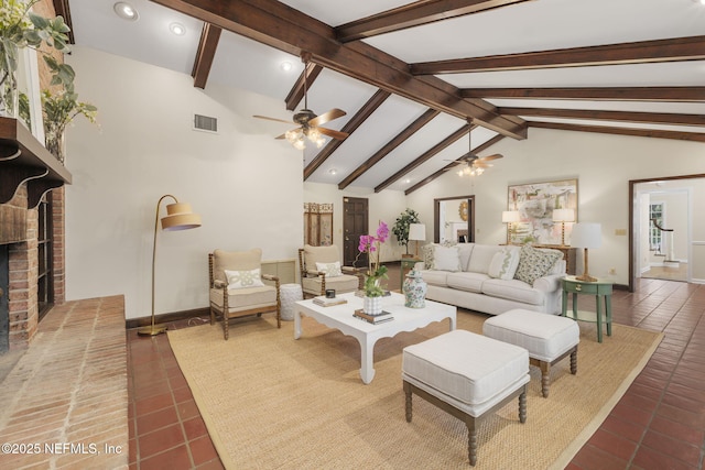 tiled living room featuring a brick fireplace, lofted ceiling with beams, and ceiling fan