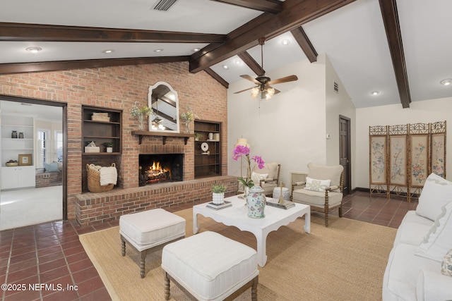 tiled living room with lofted ceiling with beams, brick wall, a brick fireplace, and ceiling fan