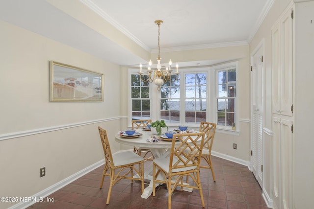 tiled dining room featuring crown molding and an inviting chandelier