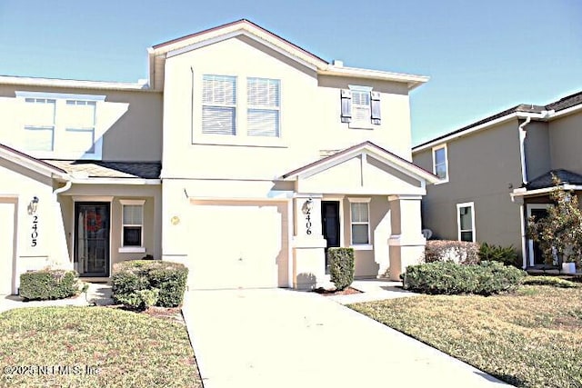 view of front facade featuring a garage and a front yard