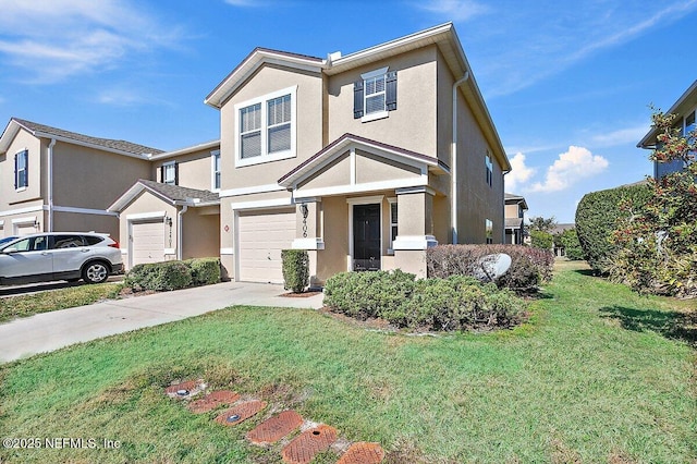 townhome / multi-family property featuring a garage and a front yard