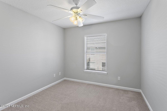 unfurnished room featuring carpet flooring, a textured ceiling, and ceiling fan