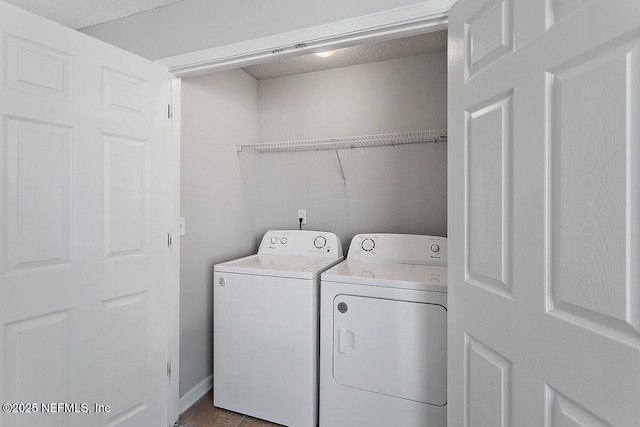 laundry area with separate washer and dryer