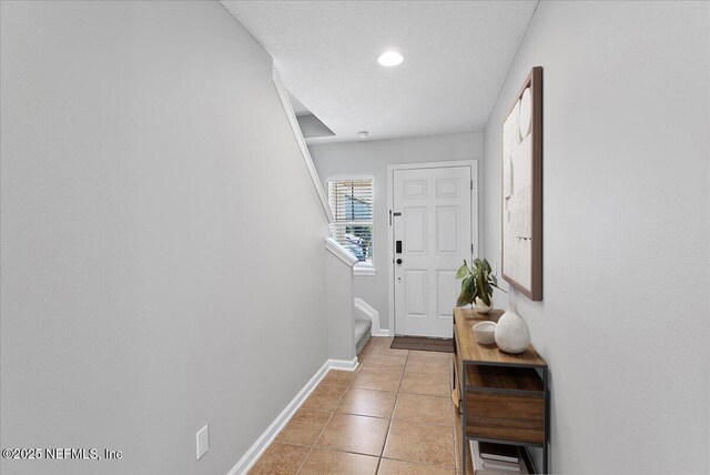 1500 Calming Water Dr Unit 2406, Fleming Island, FL 32003 - doorway to outside with baseboards, stairs, light tile patterned flooring, and recessed lighting