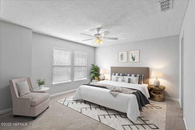 1500 Calming Water Dr Unit 2406, Fleming Island, FL 32003 - bedroom featuring carpet floors, baseboards, a ceiling fan, and a textured ceiling